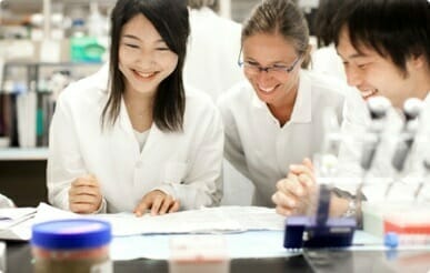 Three scientists working at a laboratory bench at Kyowa Kirin North America